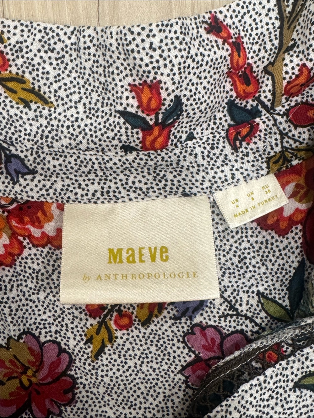 Anthropologie Gray Floral Henley Peplum Top with Red & Green Accents - Picture 3 of 3